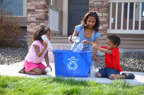 Workers sorting construction materials for recycling